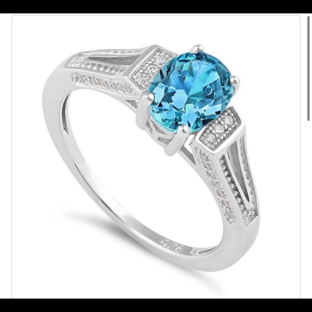 Sterling Silver Blue Topaz Oval Cut CZ Ring
